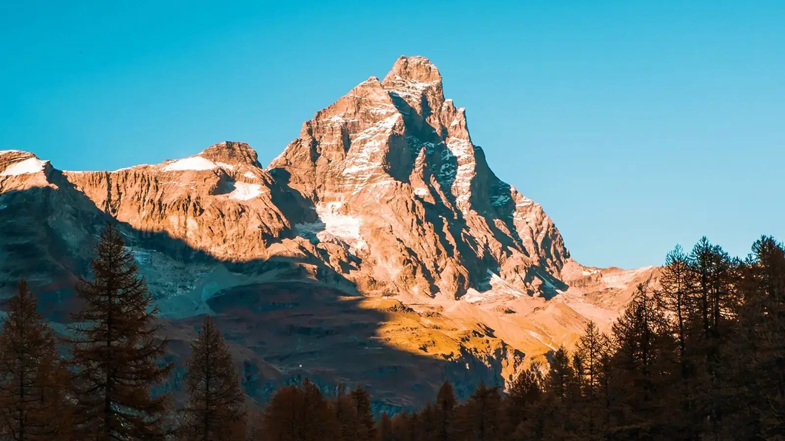 A high mountain against a blue sky