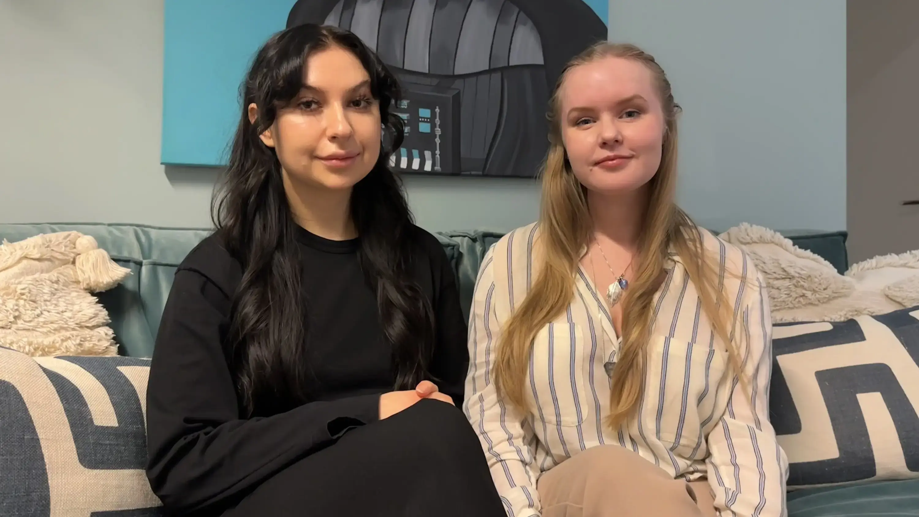 Nina Lyszczarz and Susanne Norén sitting in a sofa at Esatto's Stockholm office.