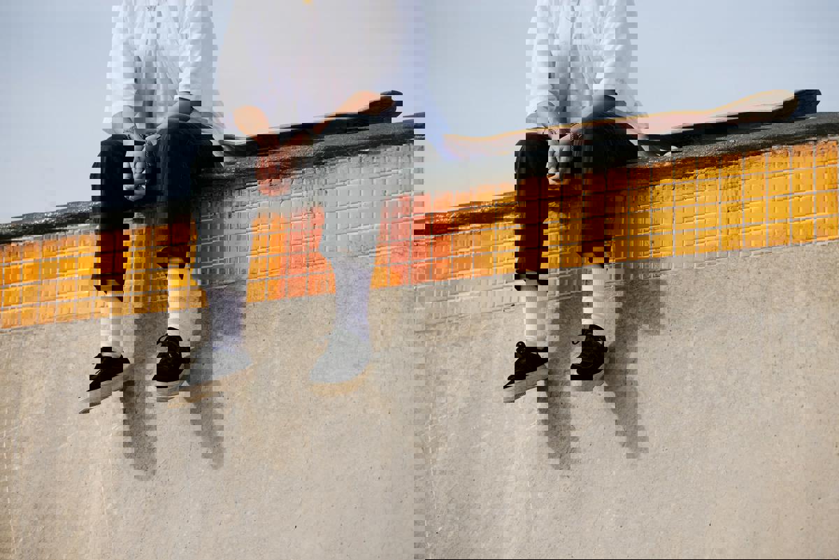 woman sitting on a wall